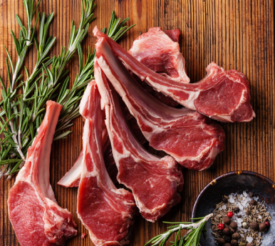 fresh cut lamb on a wooden surface