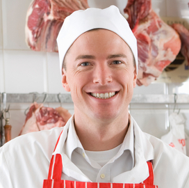 Male Jenkins bitcher wearing safety cap and smiling